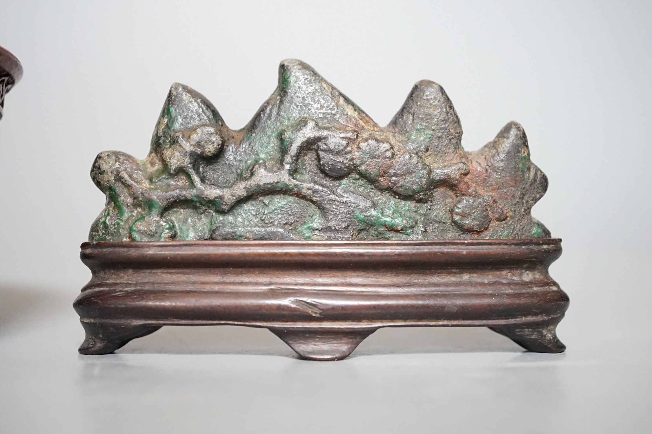 A Chinese painted metal brush rest on stand and a red lacquered bowl, 11cm
